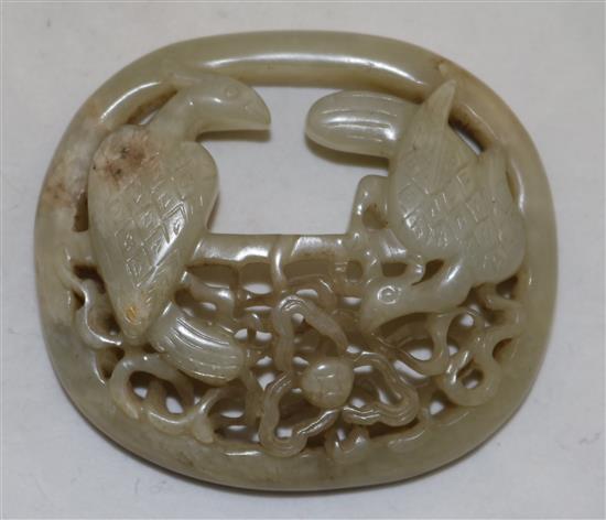 A Chinese pale celadon jade oval plaque, probably 17th / 18th century, 7.3cm